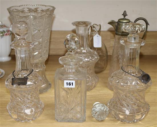 A collection of continental glass decanters, claret jug with plated mount, a decanter and a cut glass vase